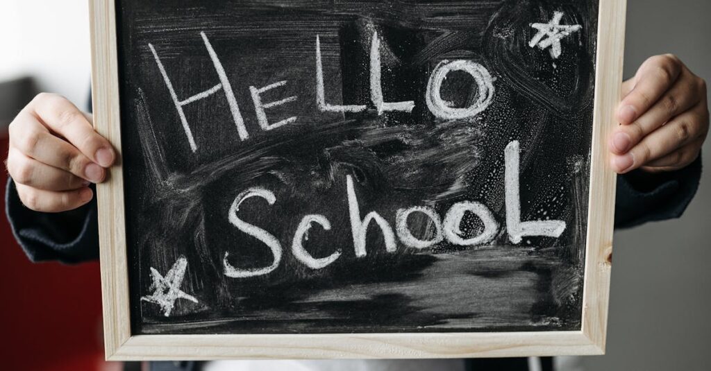 Close-up of hands holding a chalkboard with 'Hello School' message, perfect for back-to-school themes.