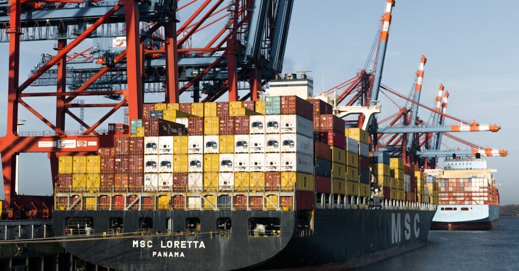 pexels-photo-29091982-29091982 Aerial view of cargo ships at Hamburg port terminal with cranes and shipping containers.